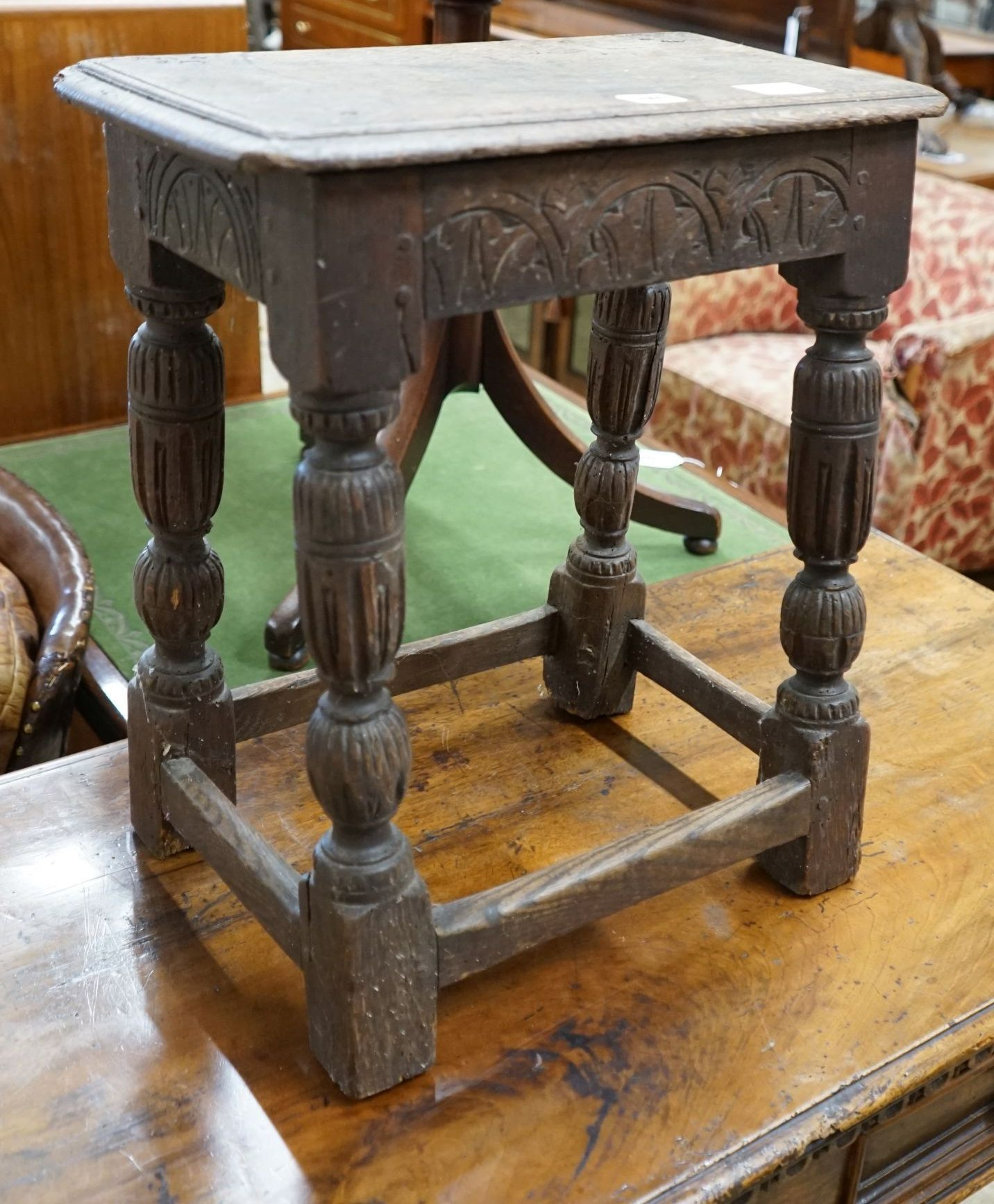 An oak joint stool (wormed), width 45cm, depth 27cm, height 52cm